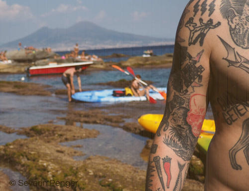 A charm-like cornicello-tattoo (amongst others) in front of mighty Vesuvius